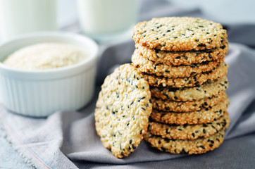 Sesame cookies with glasses of milk