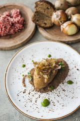 baked potatoes with onions closeup