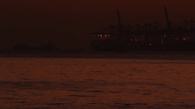Cargo port at night - Shenzhen, Guangdong province, China; handheld footage