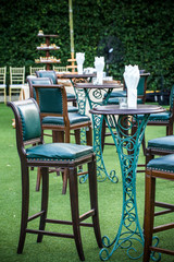 Wedding. Banquet. The chairs and table for guests,  The table stands on a green