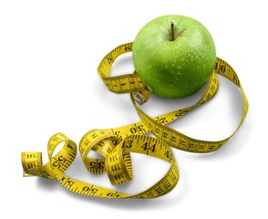 A Green Apple and a Measuring Tape