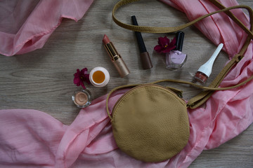 women's cosmetic bag and lipstick, shadows, cream and varnish