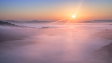 Sunrise over Mountains with Clouds