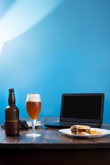 wooden table with beer and food