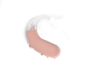 Hearing aid close up on white background with batteries