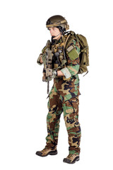 Portrait soldier or private military contractor holding sniper rifle.