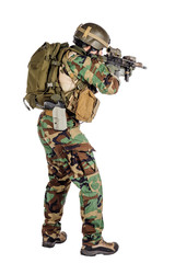 Portrait soldier or private military contractor holding sniper rifle.