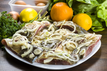 Carp marinated in onions