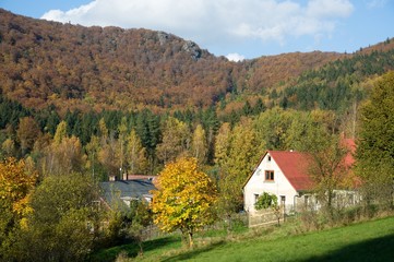 Fototapeta na wymiar Village Oldrichov v Hajich and granite rock Lyse skaly in the Jizera mountains, Northern Bohemia, Czech republic
