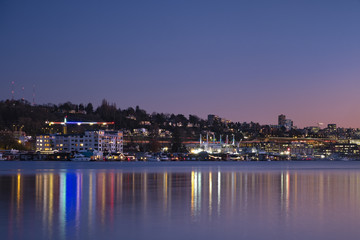 Sunset over Seattle's skyline creating reflections in Lake Washington
