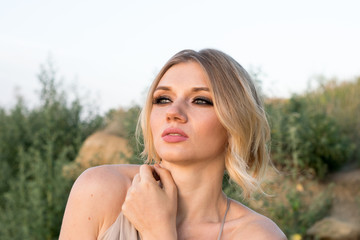 Naklejka premium close-up portrait of a beautiful young woman with white hair, beautiful big eyes and sensual lips. Passion blonde with beautiful blue eyes