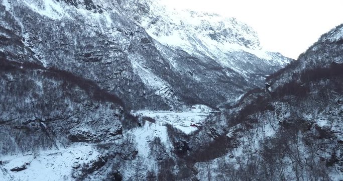 FLAM / AURLAND, NORWAY &ndash; FEBRUARY,2017 : Aerial shot of amazing landscape at sunset with snowy mountains and viking warrior in view