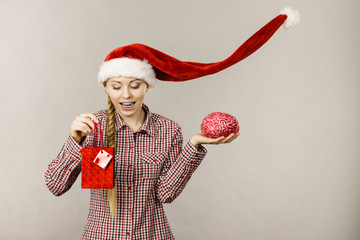 Christmas woman holding shopping bag and brain
