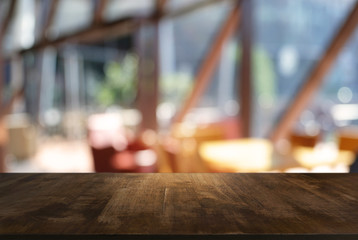 Empty wood table top and blur of night market background/selective focus .For montage product...