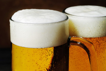 Close-up of two mugs of beer.