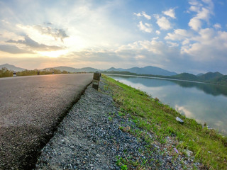 Layers of water reservior; raod, green feild and lake