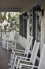 White Rocking Chairs on a Balcony