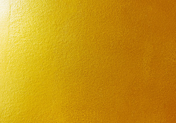 abstract background. shiny yellow of gold foil texture