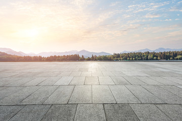 empty square floor and mountain nature landscape in city park