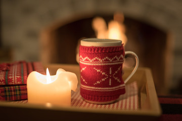 Cozy warm drink by the fire with copy space 