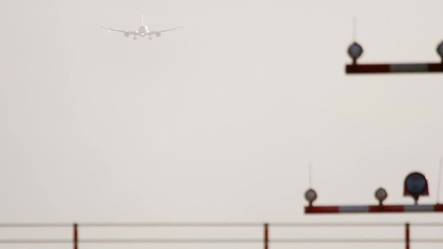 Widebody aircraft approaching at sunrise