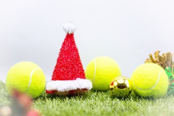 Tennis ball with Christmas ornament for Tennis player on white background