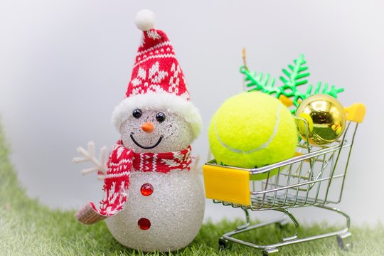 Tennis ball with Christmas ornament for Tennis player on white background