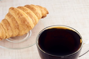 Delicious croissant. Hot tea. Dessert