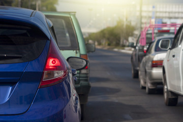 Cars on the road heading towards the goal of the trip.and stop on highway by traffic jam in city. 