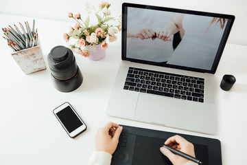 retouching on computer laptop