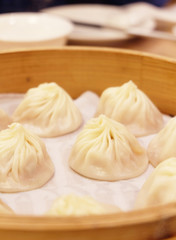 Fototapeta na wymiar Closeup chinese dumplings in wooden steamer