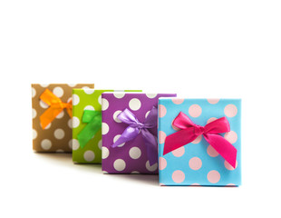 Group of gifts from multi-colored boxes with ribbons