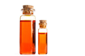 Two bottles  with oil isolated on white background