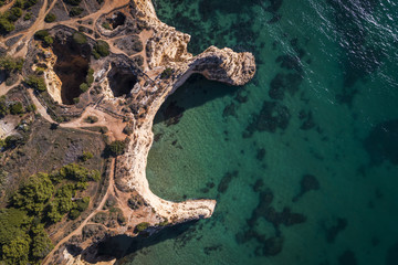 Aerial view of the coastline in the Praia do Alemao in Portimao, Algarve, Portugal; Concept for...