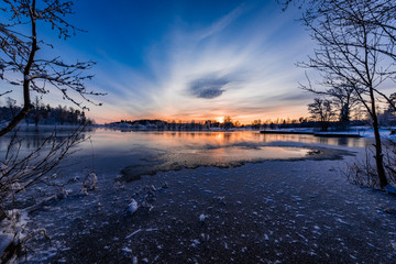 Sunset over a snowy and cold varmland, Sweden