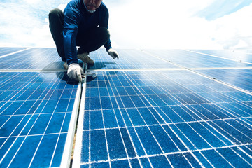 engineer team working on replacement solar panel in solar power plant;engineer and electrician team...