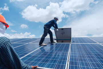 engineer team working on replacement solar panel in solar power plant;engineer and electrician team swapping and install solar panel after solar panel voltage drop.