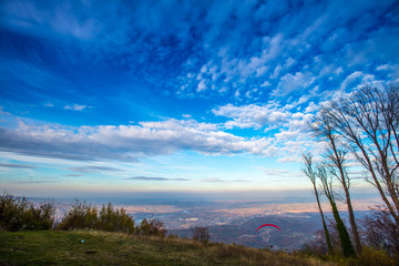 red paraglider landscape