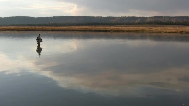 a angler casts to a trout at the Railroad Ranch section of the Henry's Fork River in Idaho