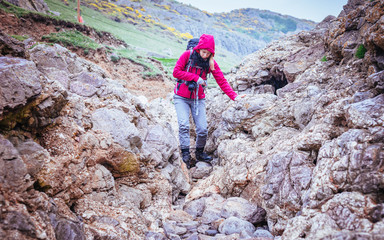 Woman  On The Rocky Beach In Rhossili Bay, Walesh Coast Path, Wa