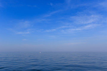 Naklejka na ściany i meble Boat trip. Meditation and relaxation. Smooth water of the blue sea