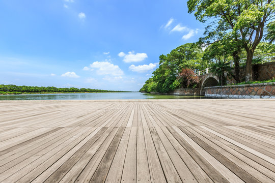 Wooden Board Observation Deck And Lake Landscape In City Park