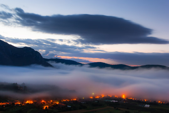 Morning landscape with fog over Coltesti Village in Apuseni Mountains(Trascau), Romania