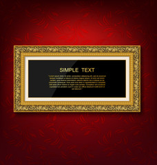 Gold vintage picture frame on red wall