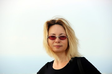 A beautiful woman against a horizon, sea, and sky