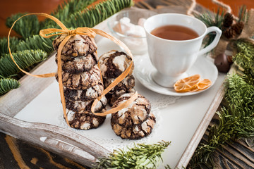 Obraz na płótnie Canvas Chocolate cookies. Cookie with cracks. Cracked chocolate biscuits. Christmas chocolate cookies. Christmas biscuits. Chocolate cookies with cracks.