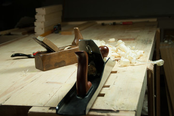 Woodworking planes on a workbench in the workshop.