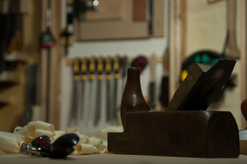 A group of tools whit a old woodworking plane in focus.