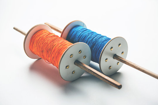 Fikri /Reel/Chakri /Spool with colourful thread or manjha or manja for Kite flying in Indian festival called Makar Sankranti which is uttarayan or uttarayana
