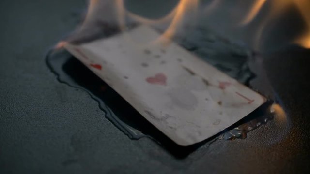 Abstract ace of hearts burns on black background hd slow motion footage for you ideas